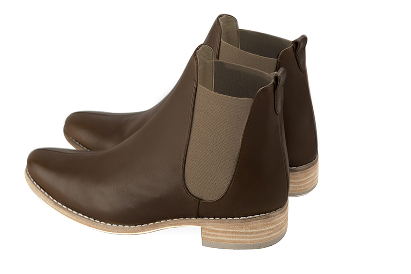 Dark brown women's ankle boots, with elastics. Round toe. Flat leather soles. Rear view - Florence KOOIJMAN